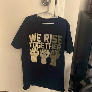 “We rise together”Spencer’s t shirt
